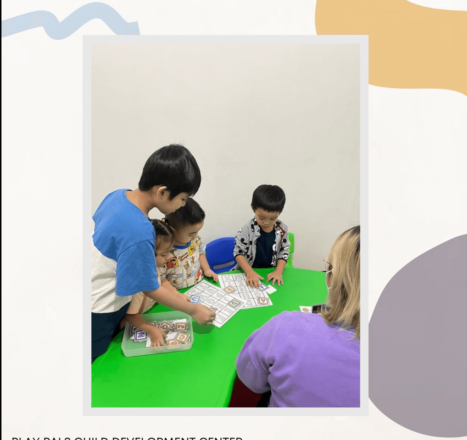 Teacher and children doing a table activity together